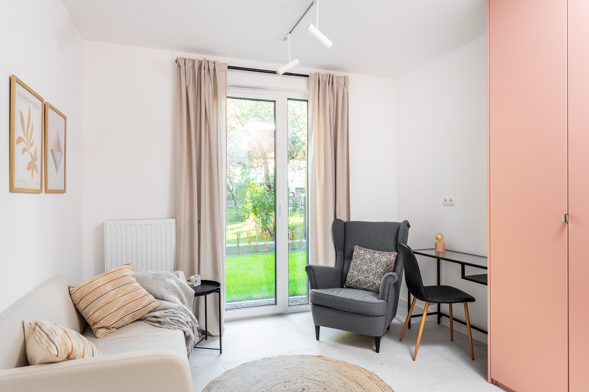 Therapy room with an armchair and a desk by a window overlooking the garden, Płaszowska 25, Kraków