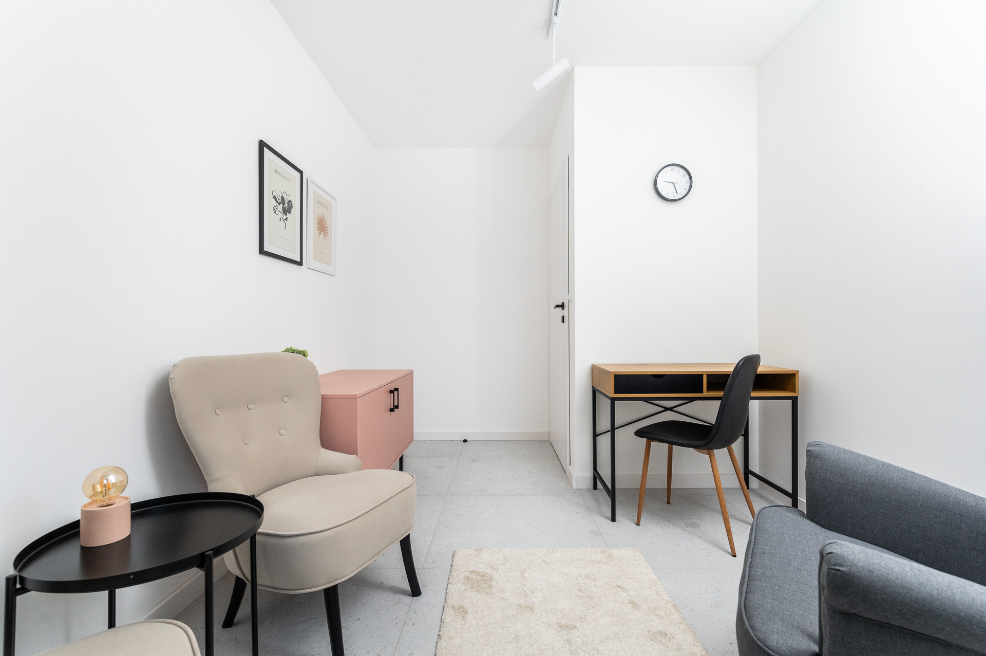Room with a beige armchair, a desk and a workspace, Płaszowska 25, Kraków